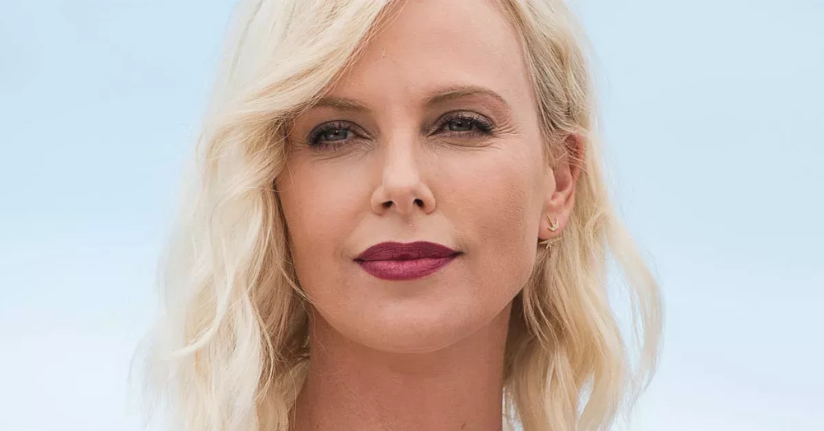 Charlize Theron Decided To Go For A Dary Bold Look With Her Platinum Pixie Cut And Fishnet Dress