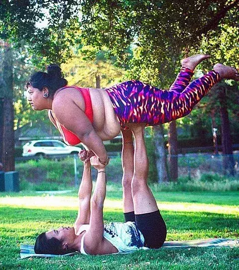 She is not afraid to do yoga with a partner