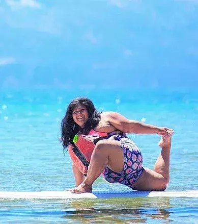 She will even try doing yoga poses on her paddleboard