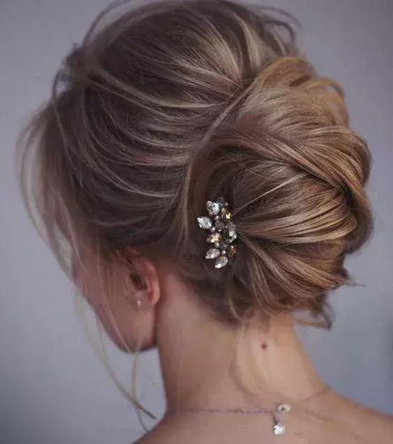 This elegant and charming side bun is suited for brides on their big day!
