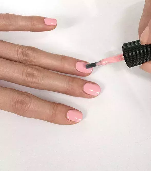 First a coat of pale pink polish