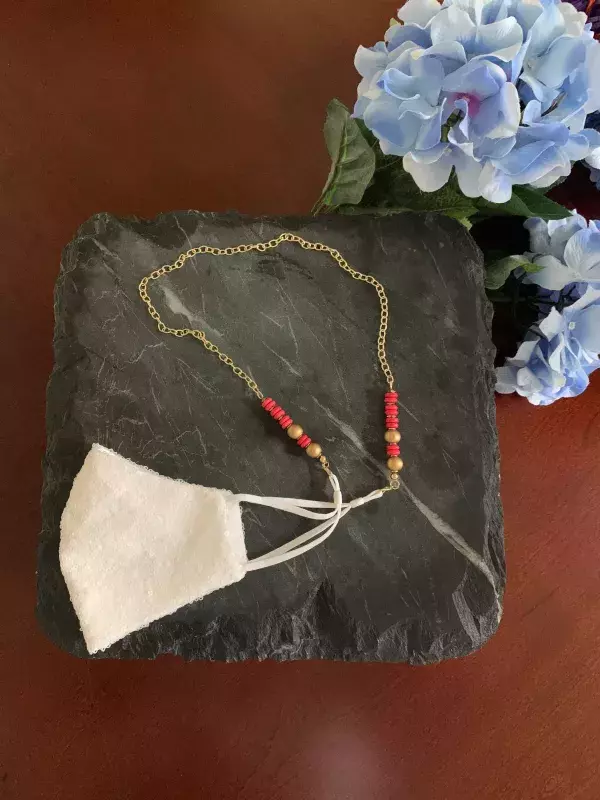 Gold chain necklace with coral beads mask chain