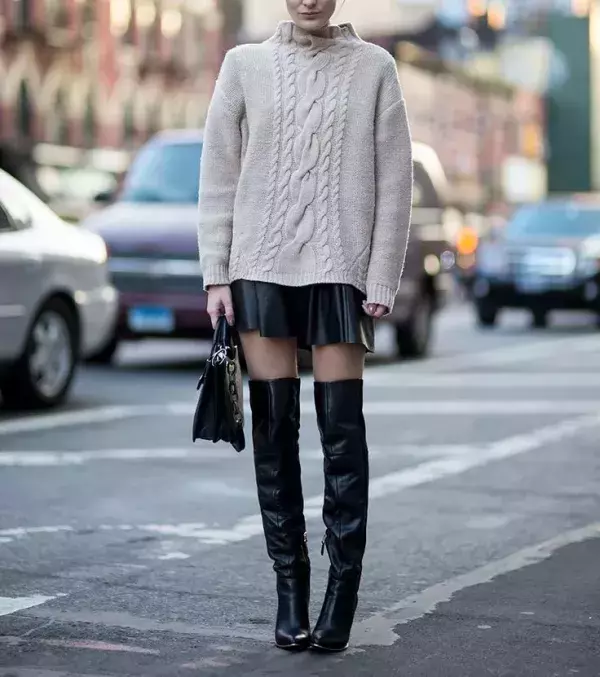A leather skirt with leather boots will complement your winter look