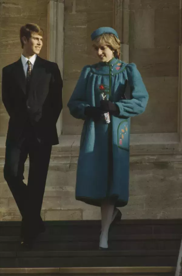 Princess Diana in a stunning teal coat and a matching hat 