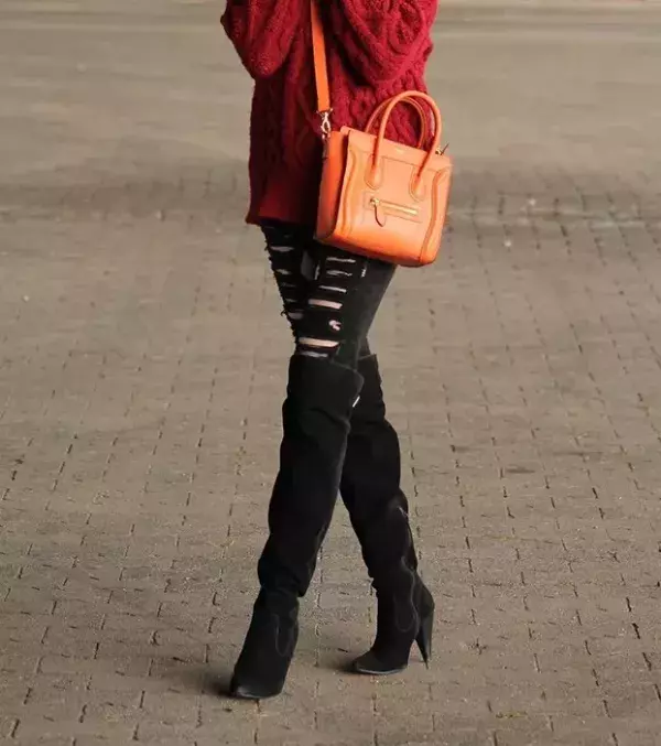 Suede thigh-high boots look great with damaged jeans