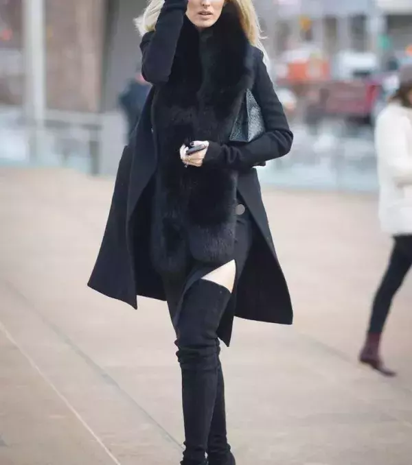 A trench coat is a must when wearing thigh-high boots