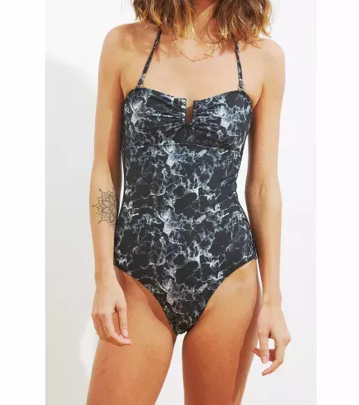 Want something on the darker side? Try this marble print one piece suit from Albertine.