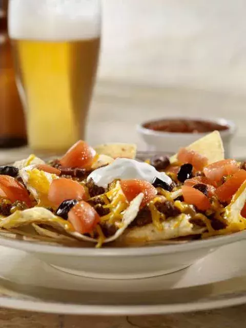 Tomato and cheese nachos                              