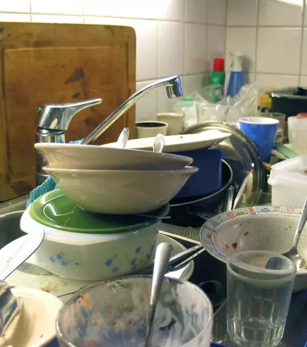 Use it while you're washing dishes. The starch from pasta will act as a detergent and will make it easier to remove food stains.
