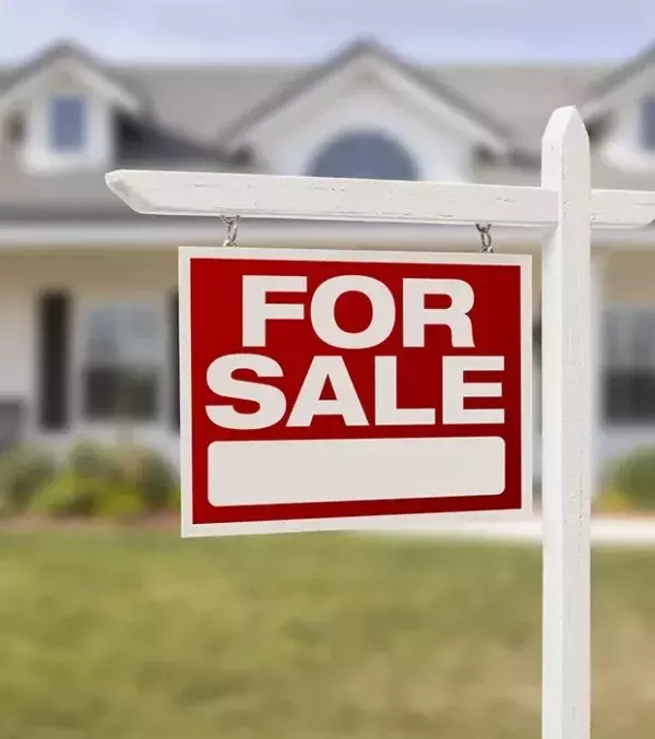 Make a fake for sale sign to make your friend believe that their apartment is for sale.
