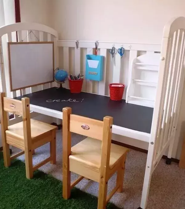 Turn an old baby's crib into a desk. It's a great way to upcycle your old furniture. All you need to do is add chalkboard paint.