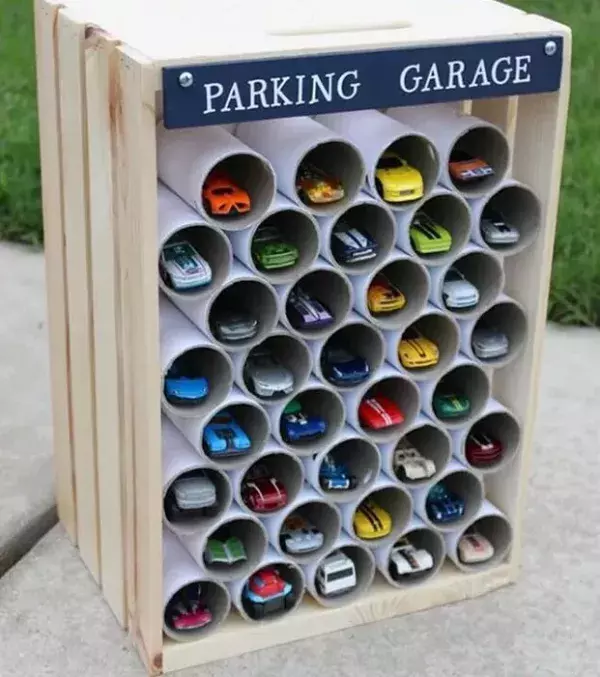 Use loo rolls to store their cars. It's a great way to avoid any clutter and mess.