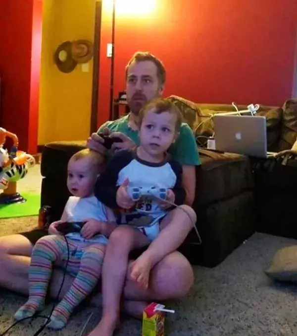 When you are playing video games give them controllers that don't work. They will think they are playing the game with you.