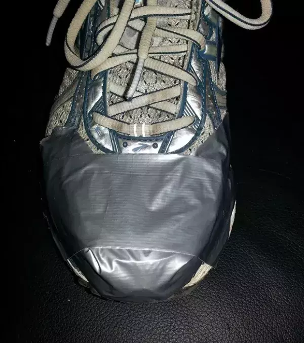 Duct tape the tops of your trainers to prevent water getting in when running in the rain.
